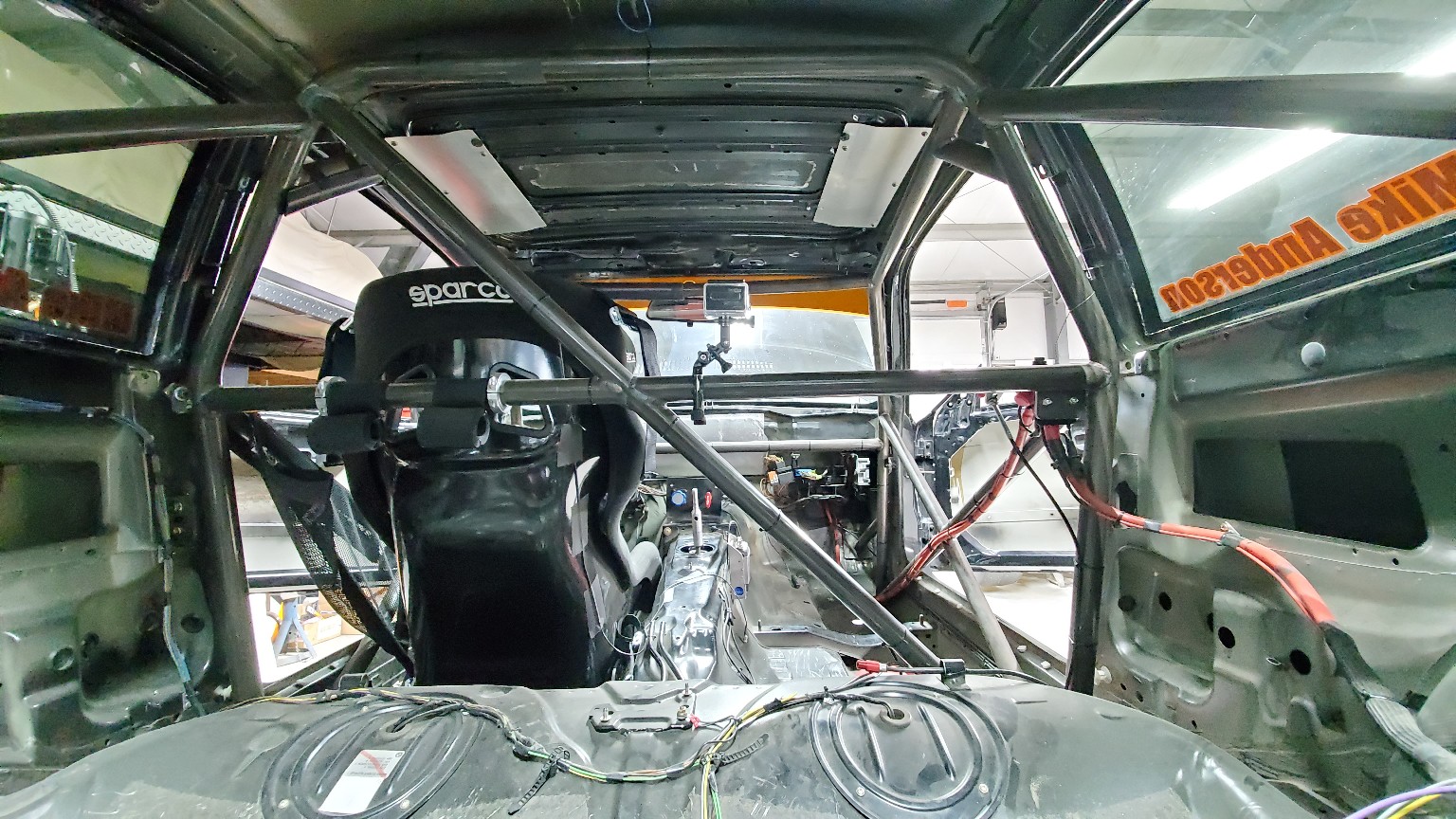 Rear interior view of the fabricated roll cage in the E36 BMW
