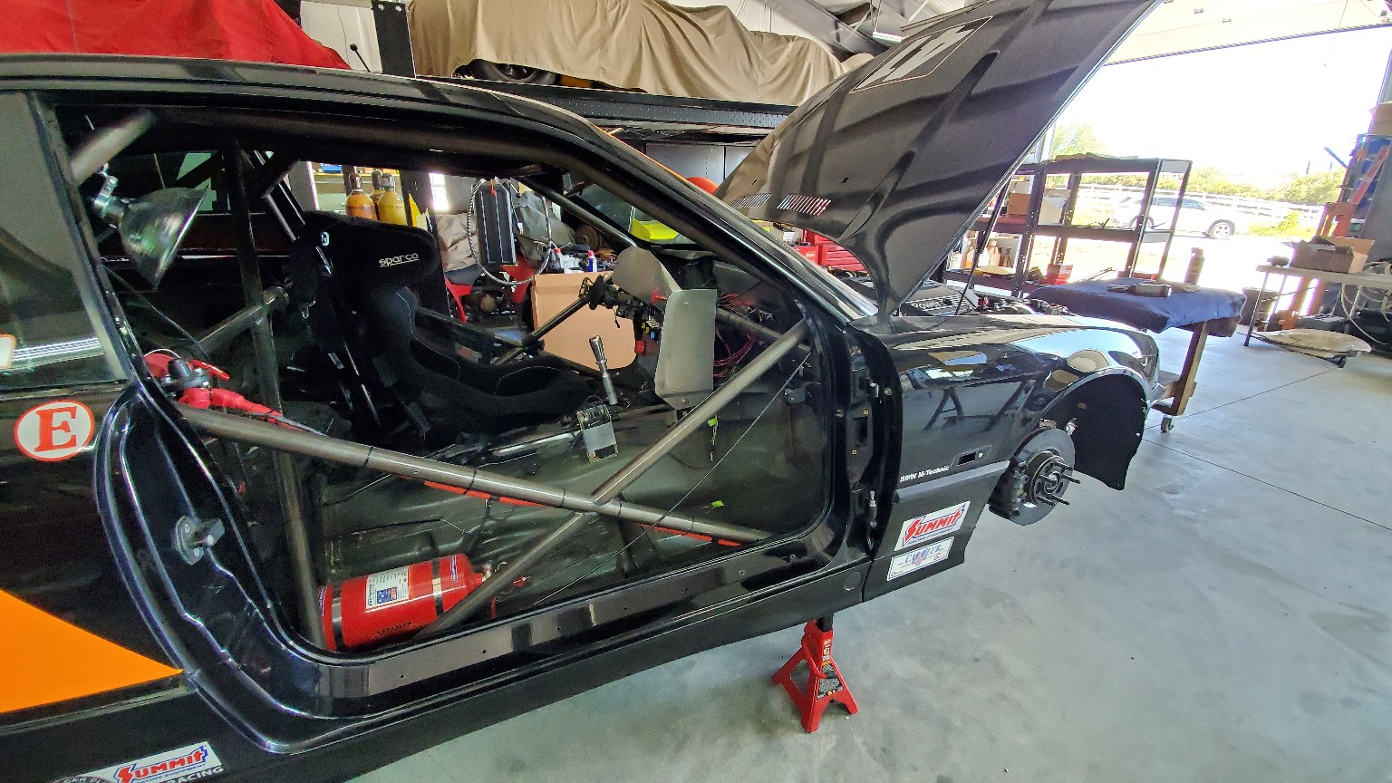 Number 42 E36 BMW on stands during development in the workshop