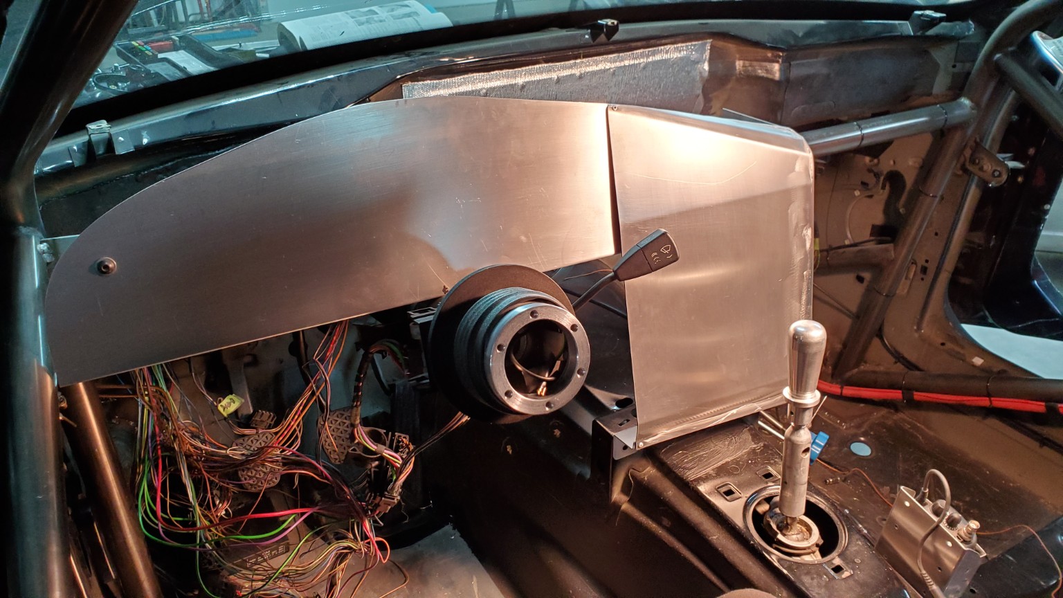 Fabricated aluminum dashboard and steering column during the E36 race car build