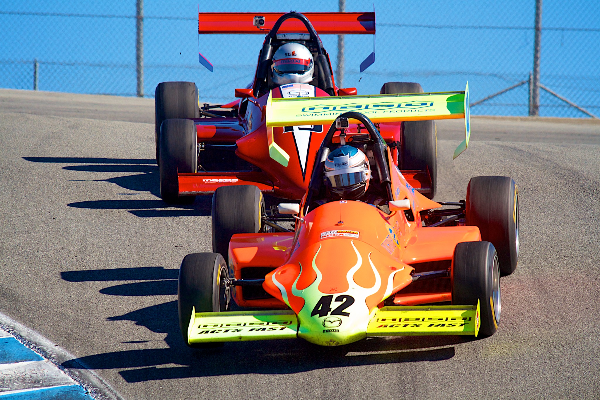 Mike Anderson's number 42 Formula Mazda leading another car on track at Laguna Seca