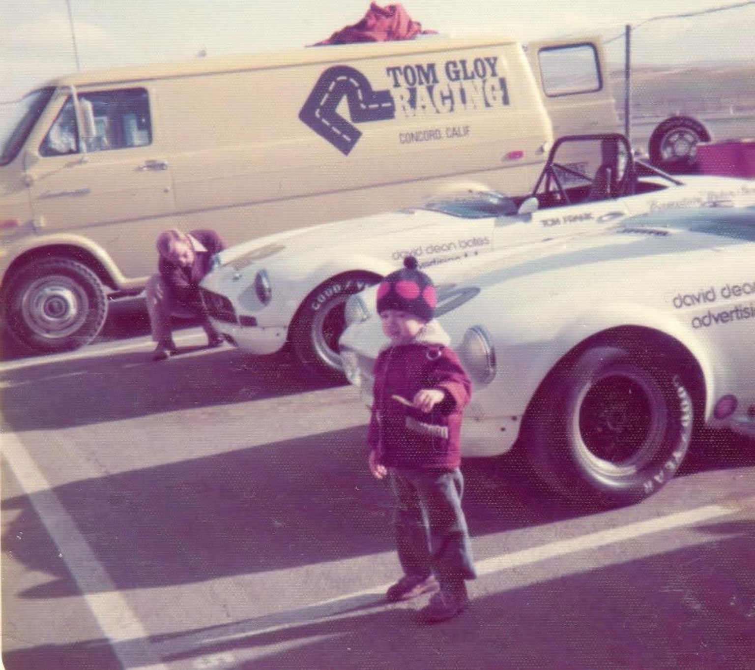 Mike Anderson as a young child in the paddock beside his father's race car