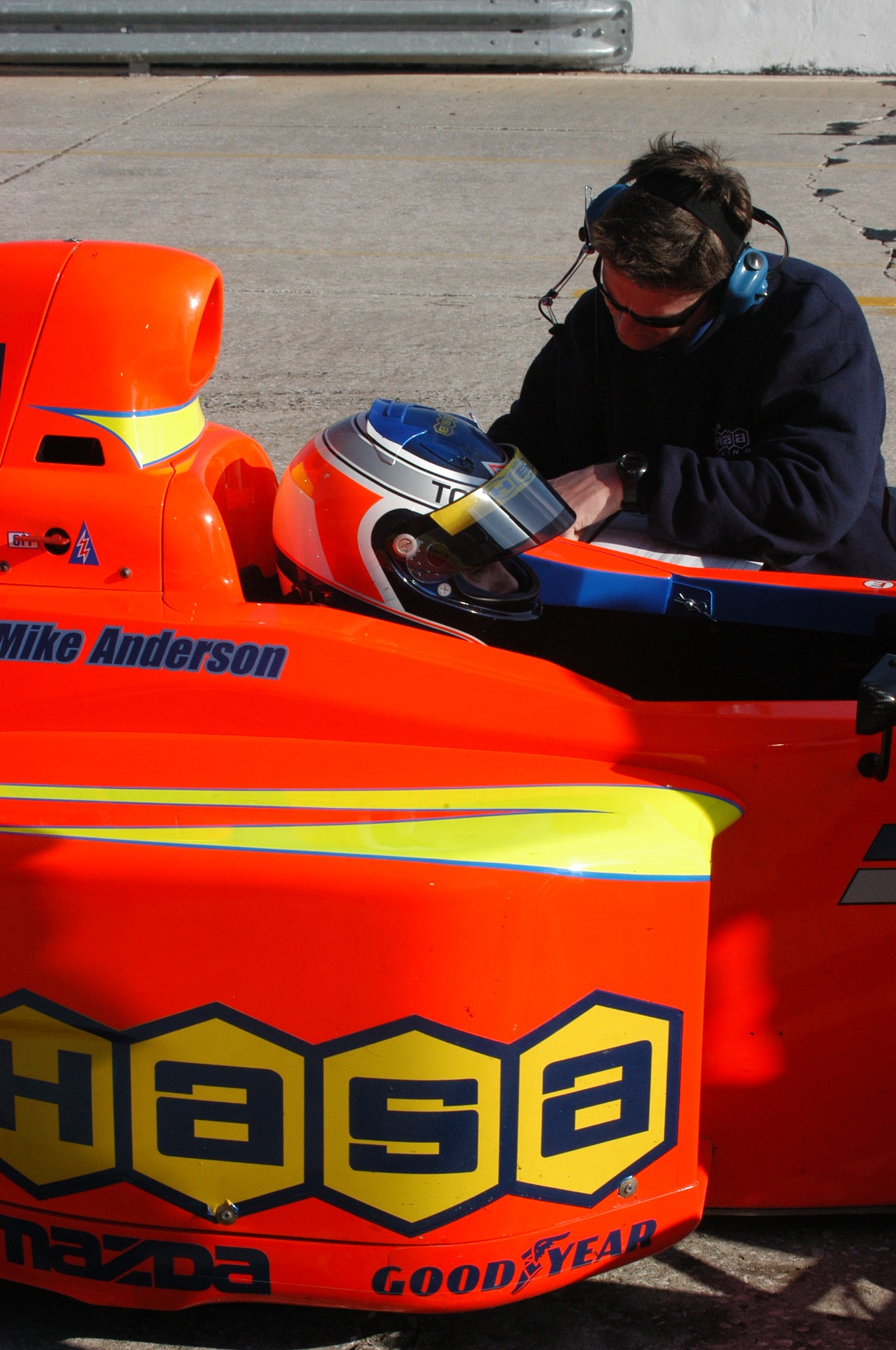 Mike Anderson in the cockpit with engineer Remi Lanteigne working beside the Pro Formula Mazda