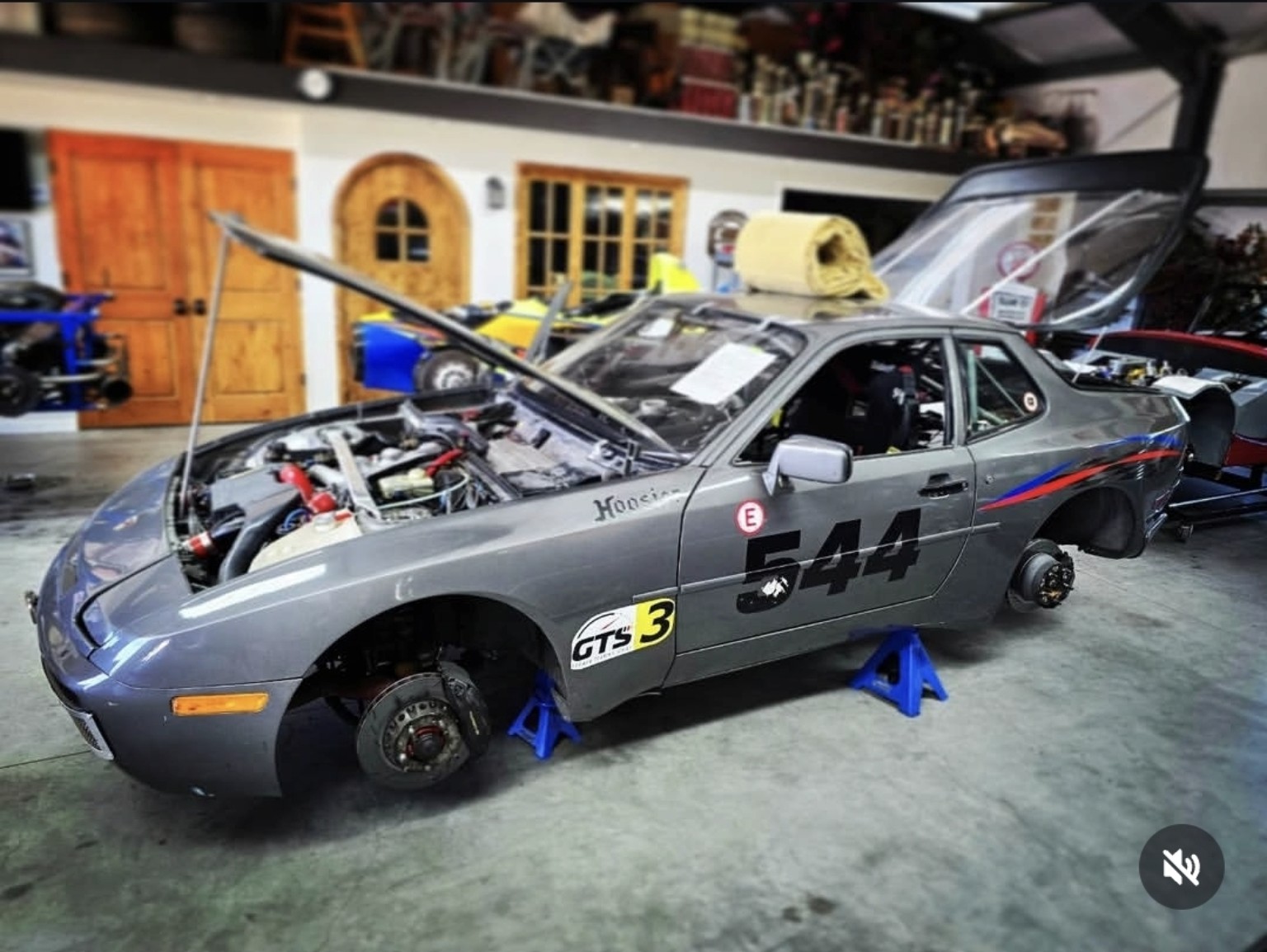 Production-based road-racing car on stands for service