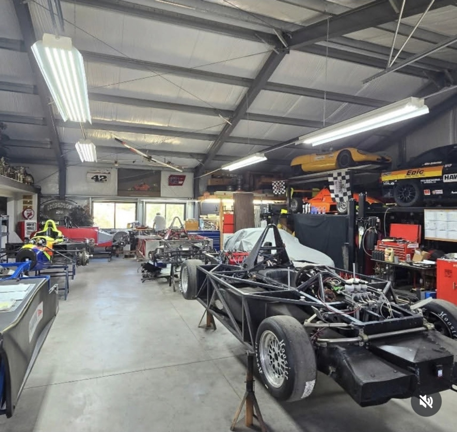 Race-car chassis and customer cars being prepared in the shop
