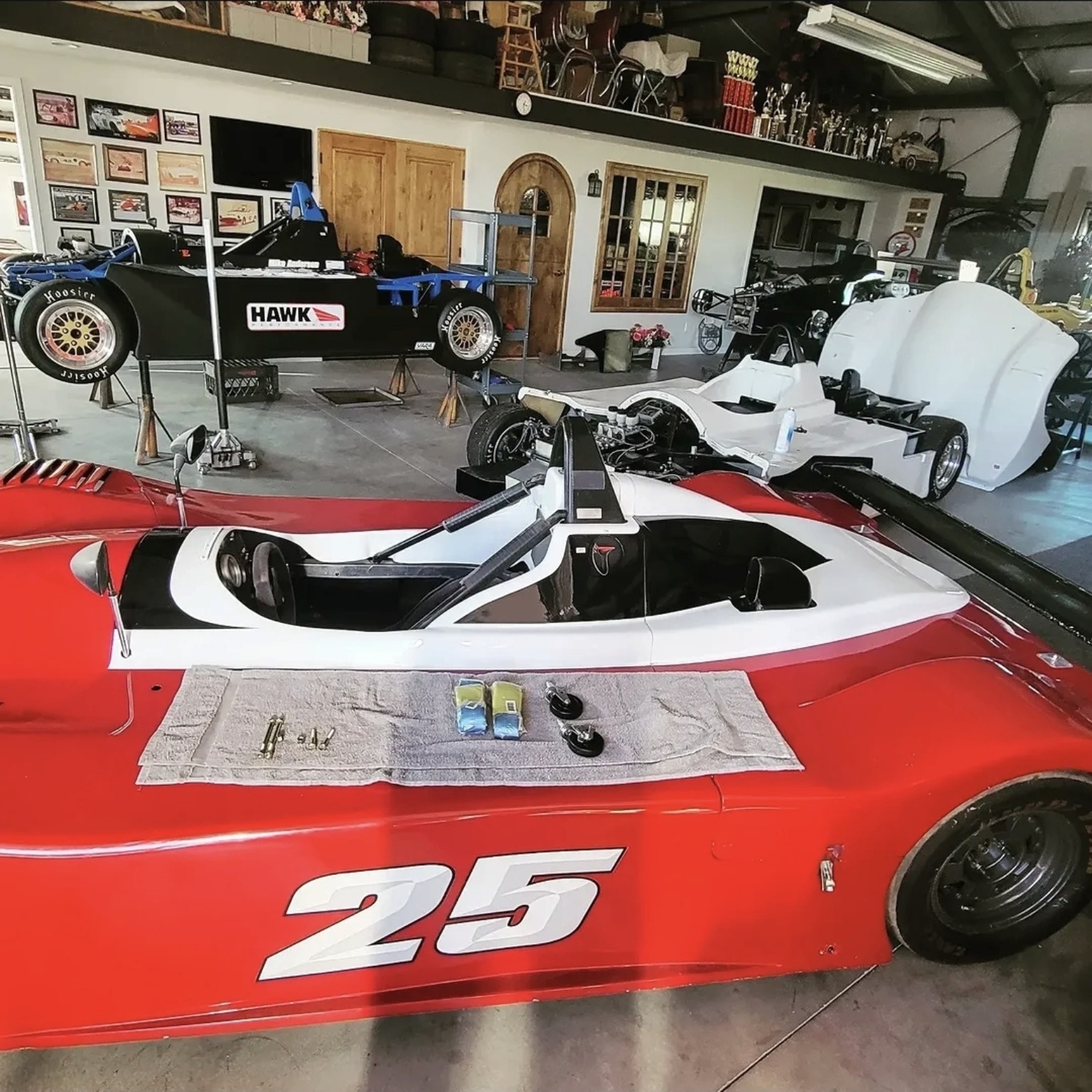 Sports racers being serviced in the workshop