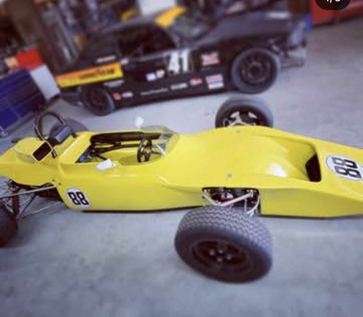 Yellow vintage sports racer in the workshop
