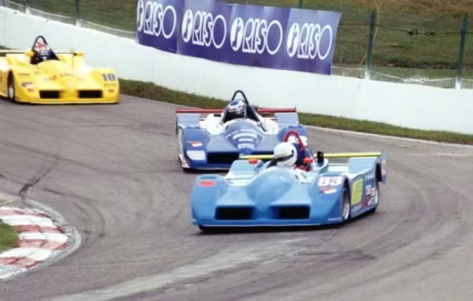 Mike Anderson's number 42 racing in a close Sports Toyota pack at Mosport