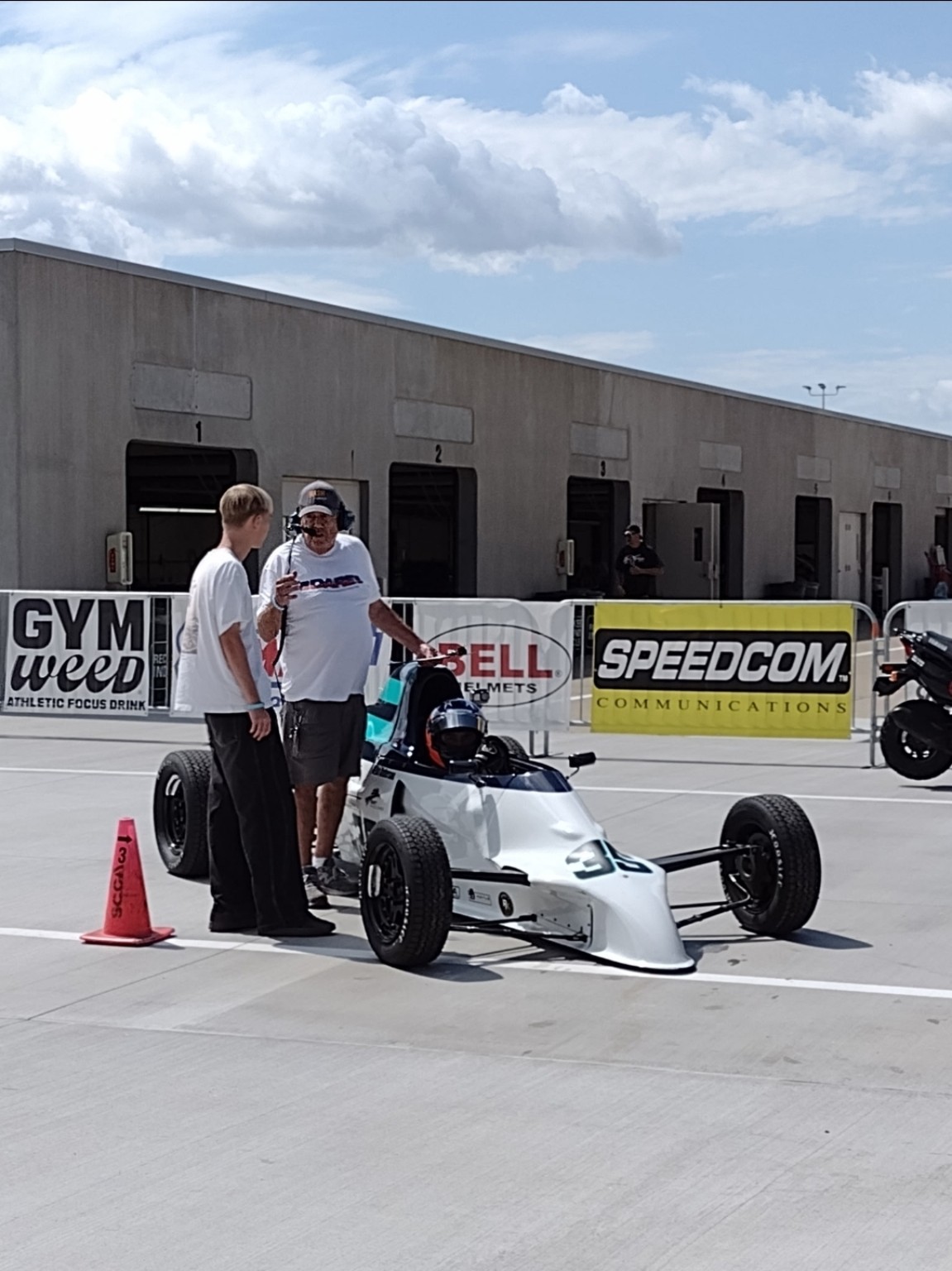 Mike Anderson on the Indianapolis grid in the Swift DB1 with his dad and his son