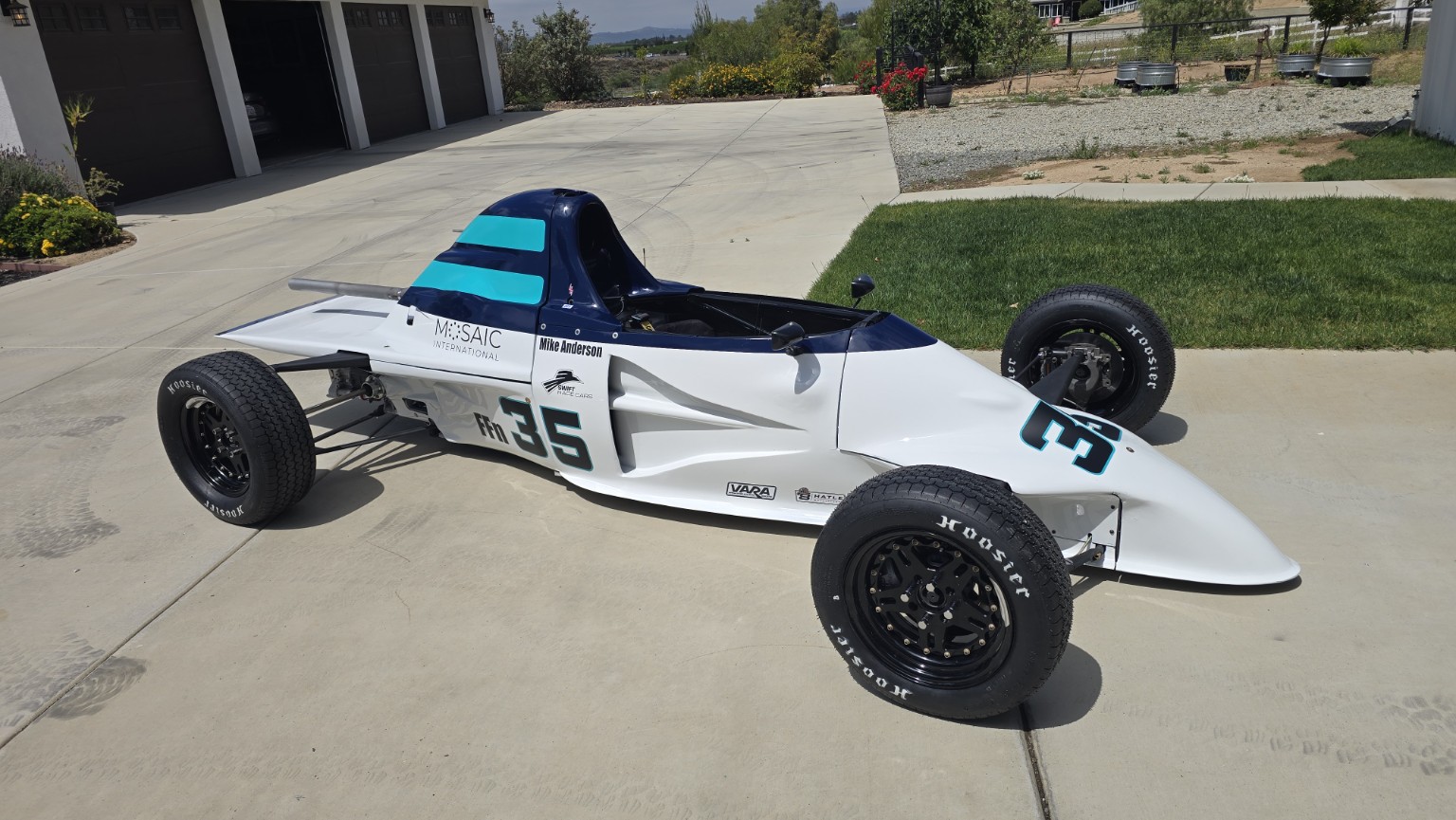 Mike Anderson's restored white, navy, and teal number 35 Swift DB1 Formula Ford